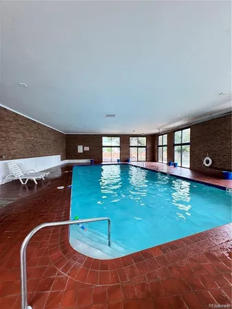 a room with pool fountain