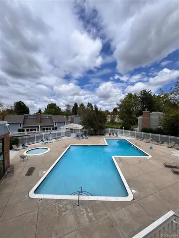 a view of a swimming pool with lounge chairs