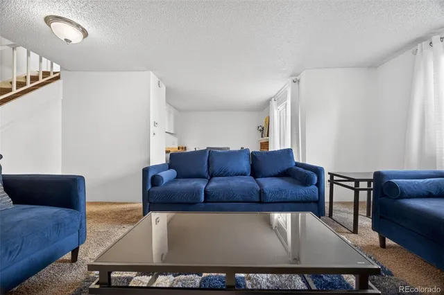 a living room with furniture and a couch