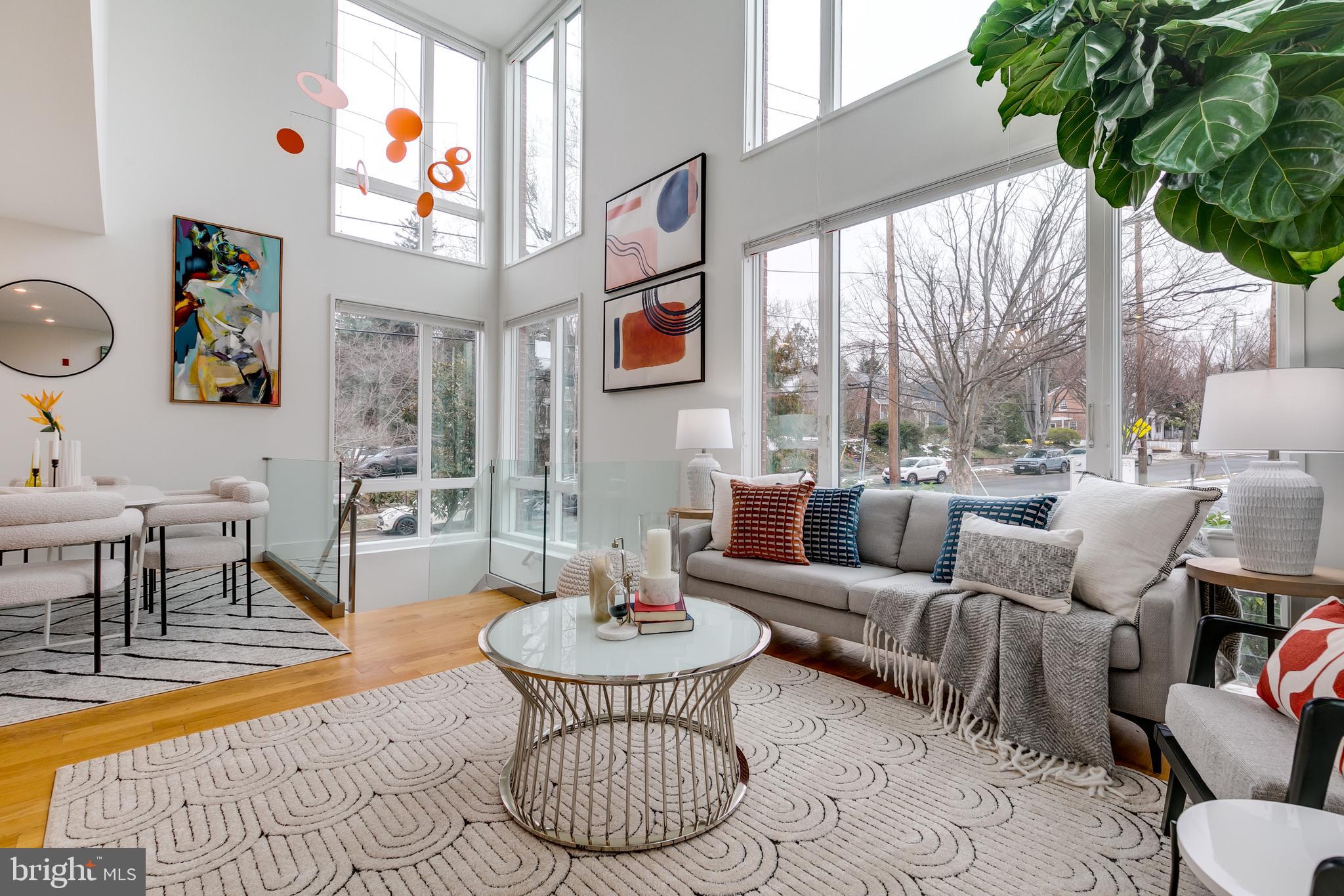 4529 MacArthur Boulevard Northwest, Unit 3 Washington, DC 20007 - Photo 1 of 50 a living room with fireplace furniture and a large window