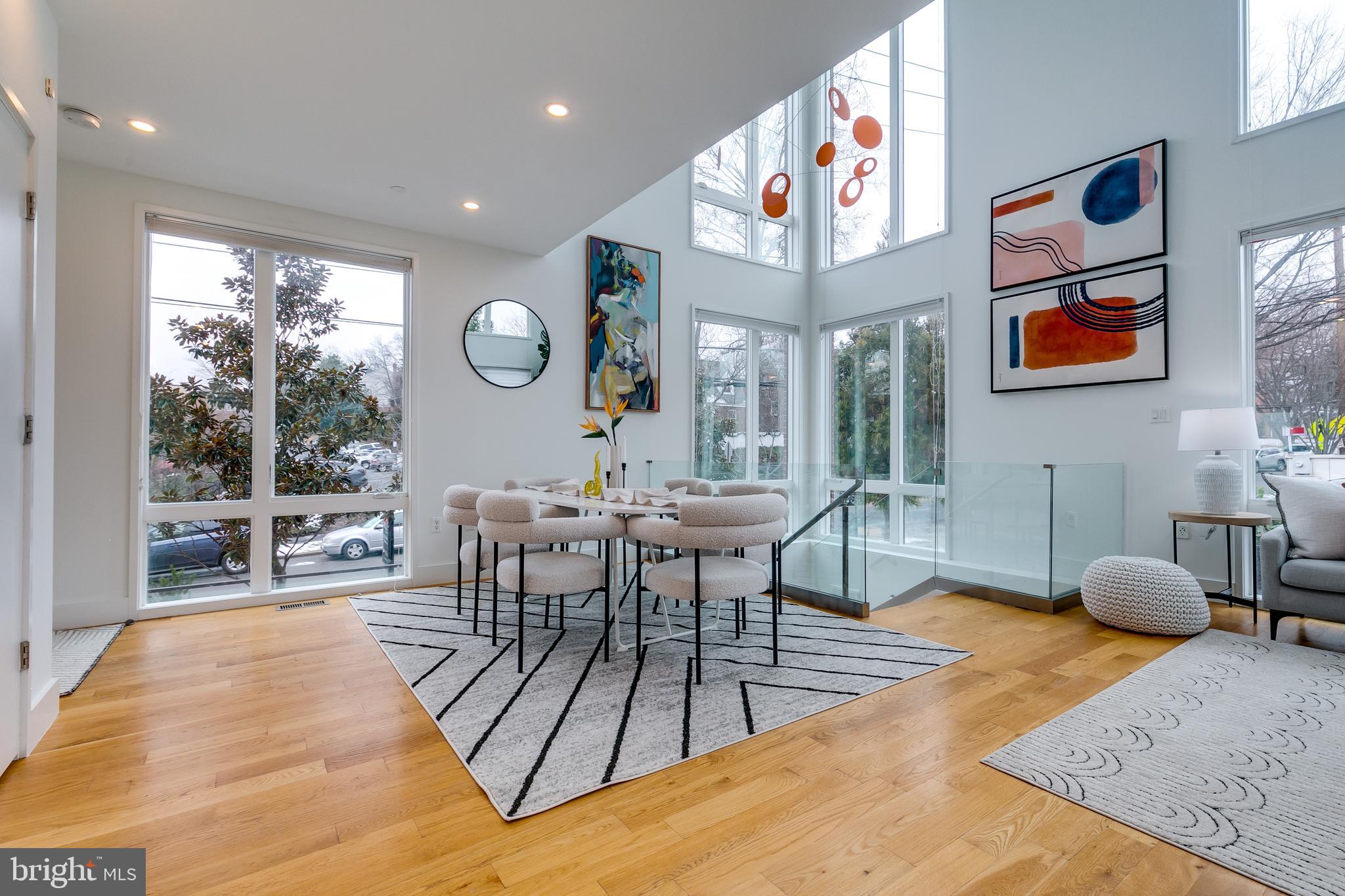 4529 MacArthur Boulevard Northwest, Unit 3 Washington, DC 20007 - Photo 28 of 50 a living room with furniture a rug potted plant and a large window