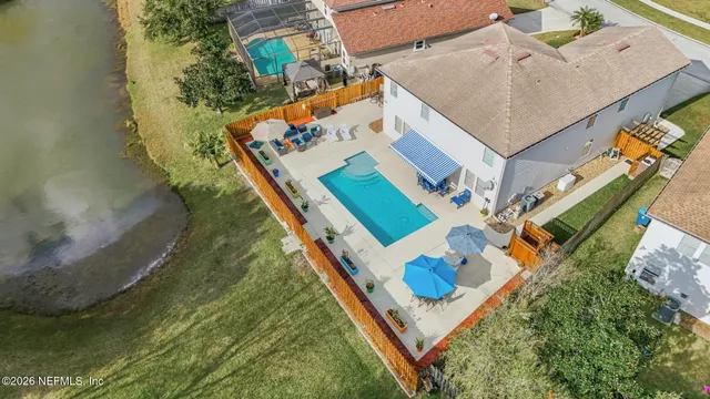 a aerial view of a house with a yard