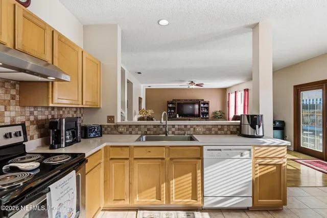 a bathroom with a sink a mirror and a bathtub