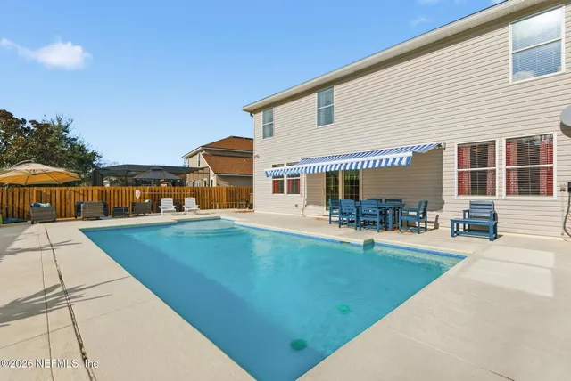 a view of chairs and tables in the patio