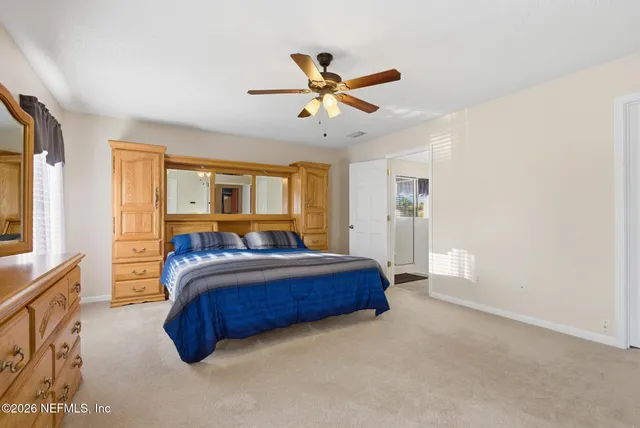 a bathroom with a sink a toilet and shower curtain