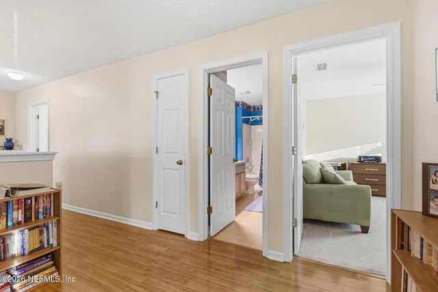 an aerial view of a house with a big yard