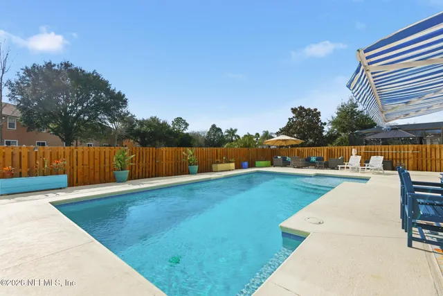 a living room with furniture or couch and a ceiling fan