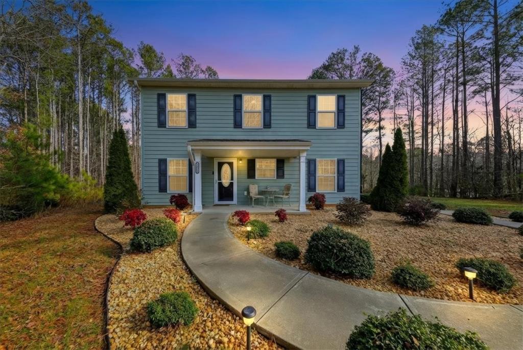 a front view of a house with yard