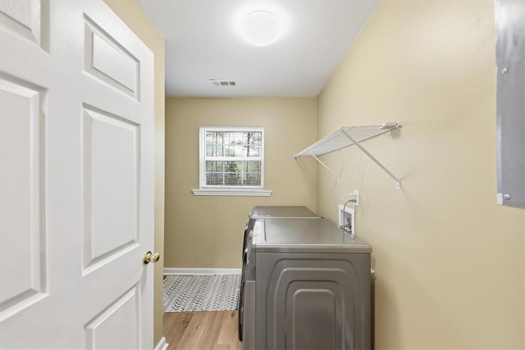 1318 Reece Road Woodstock, GA 30188 - Photo 17 of 40 a utility room with dryer and washer