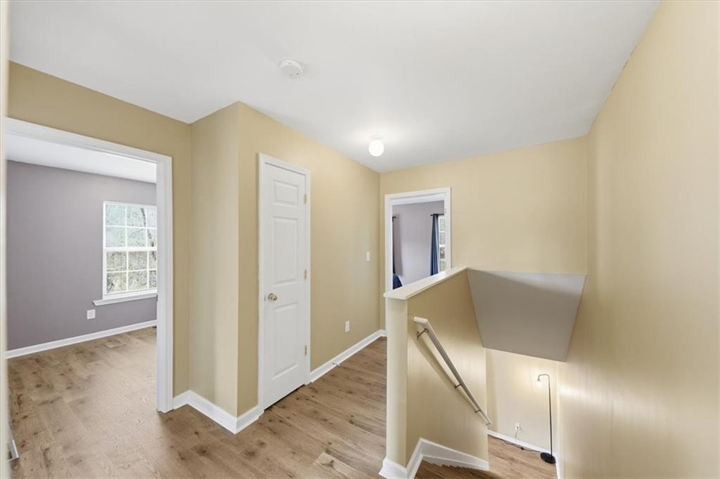 1318 Reece Road Woodstock, GA 30188 - Photo 20 of 40 a view of entryway and hall with wooden floor