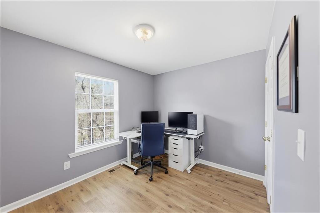 1318 Reece Road Woodstock, GA 30188 - Photo 23 of 40 a view of a workspace with furniture and a window