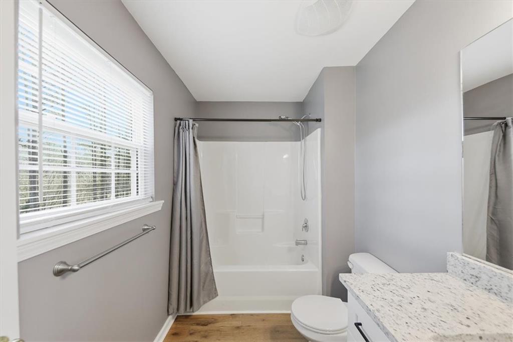 1318 Reece Road Woodstock, GA 30188 - Photo 26 of 40 a bathroom with a sink toilet and shower