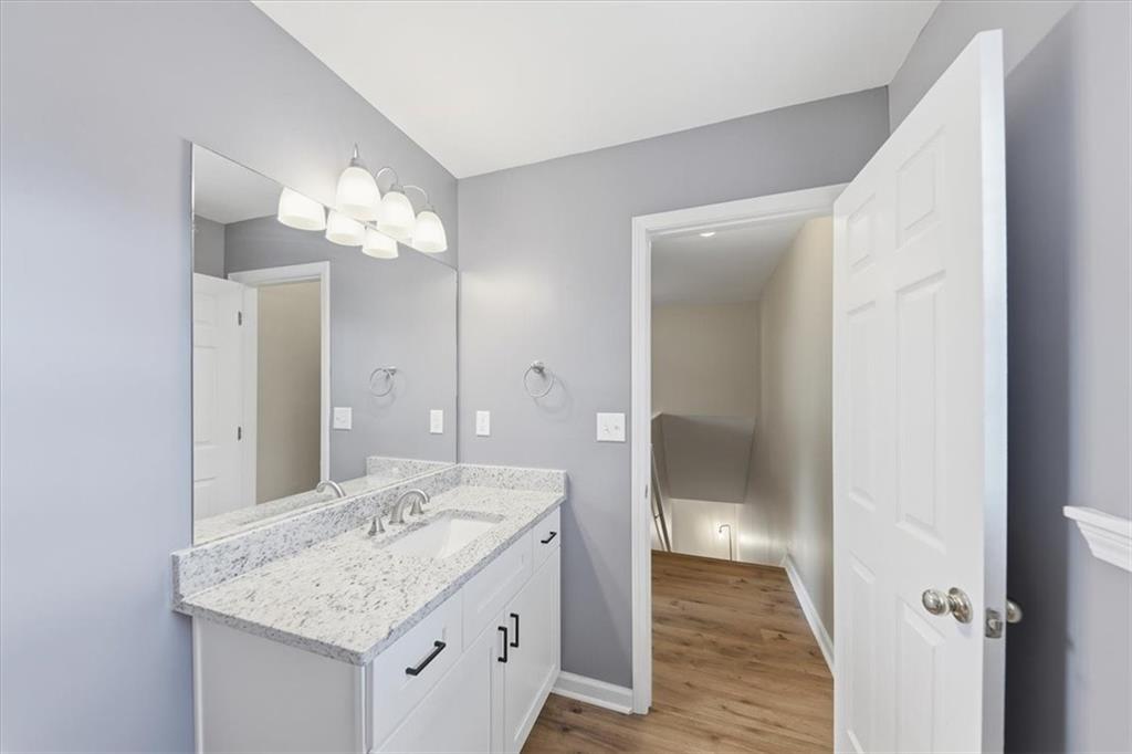 1318 Reece Road Woodstock, GA 30188 - Photo 27 of 40 a bathroom with a sink and a mirror