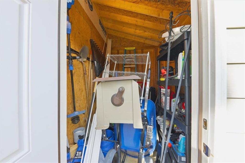 1318 Reece Road Woodstock, GA 30188 - Photo 34 of 40 a view of walk in closet with clothes and shoes