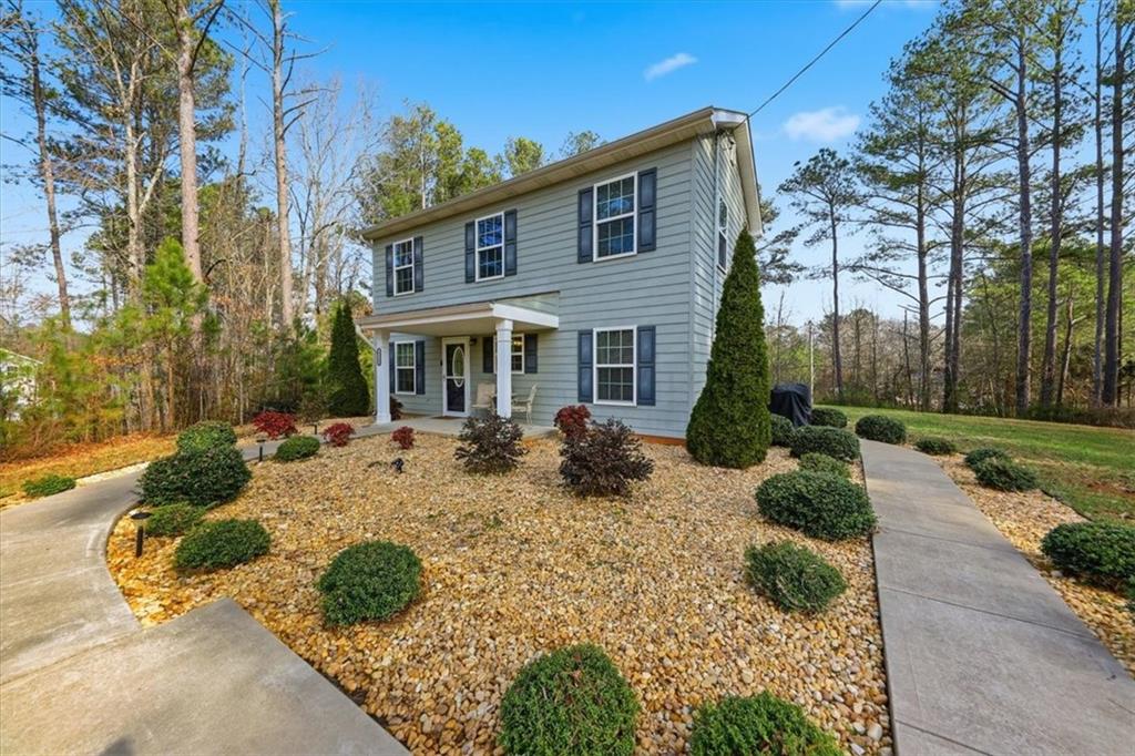1318 Reece Road Woodstock, GA 30188 - Photo 4 of 40 front view of a house with a yard