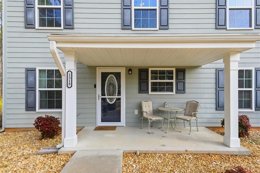 1318 Reece Road Woodstock, GA 30188 - Photo 5 of 40 a view of a house with patio