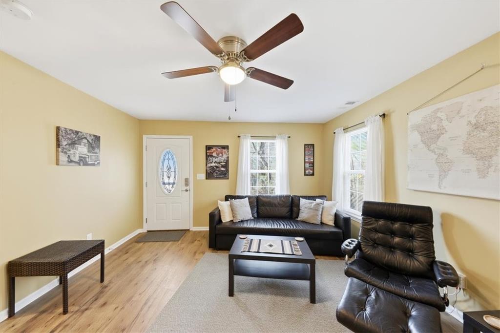 1318 Reece Road Woodstock, GA 30188 - Photo 7 of 40 a living room with furniture and a window