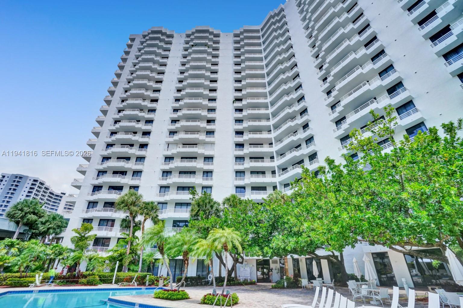3300 Northeast 192 Street, Unit 202 Aventura, FL 33180 - Photo 23 of 26 a view of a tall building