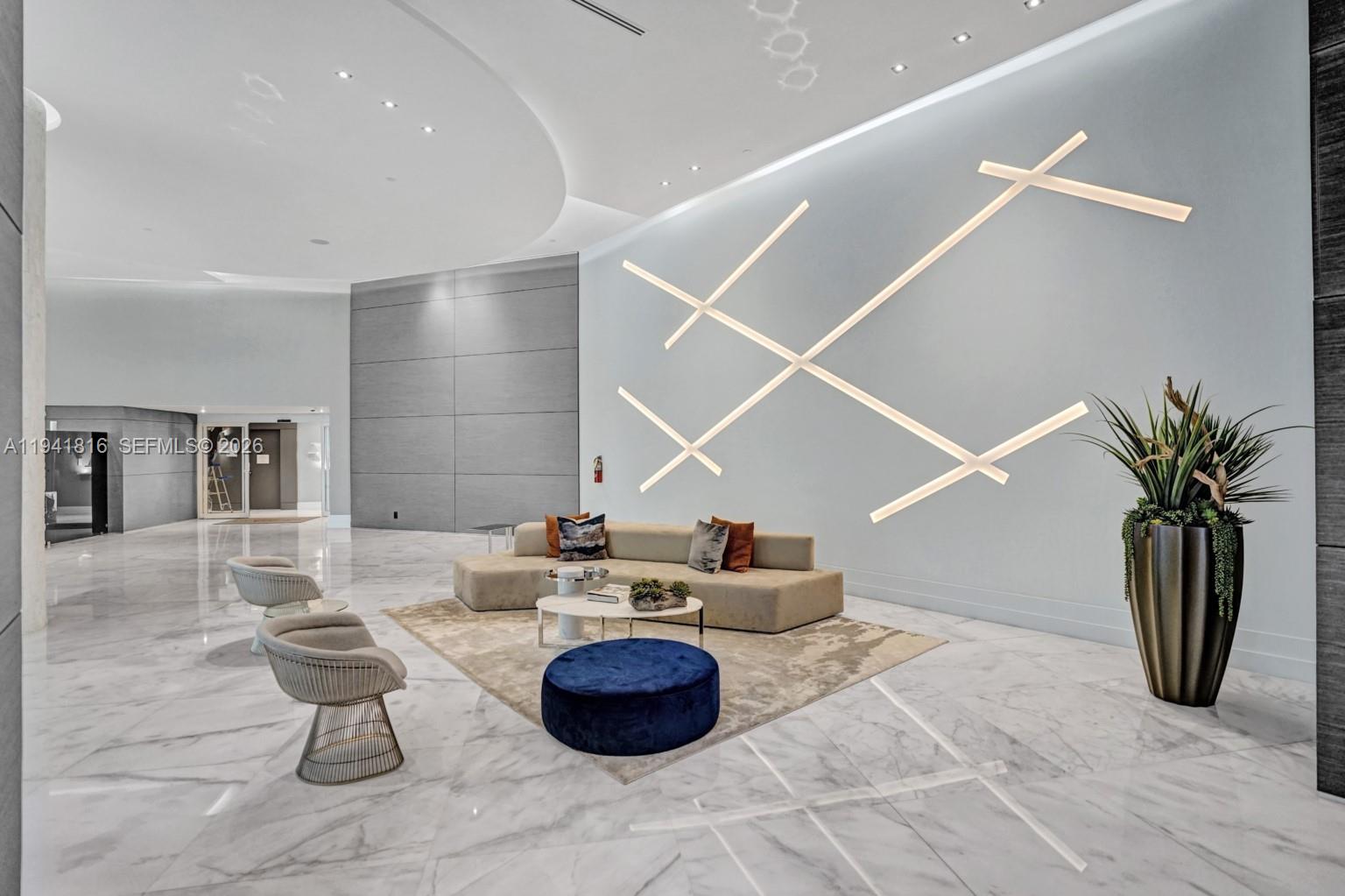 3300 Northeast 192 Street, Unit 202 Aventura, FL 33180 - Photo 25 of 26 a living room with furniture