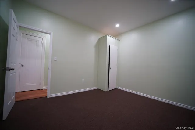 an empty room with a empty space and window