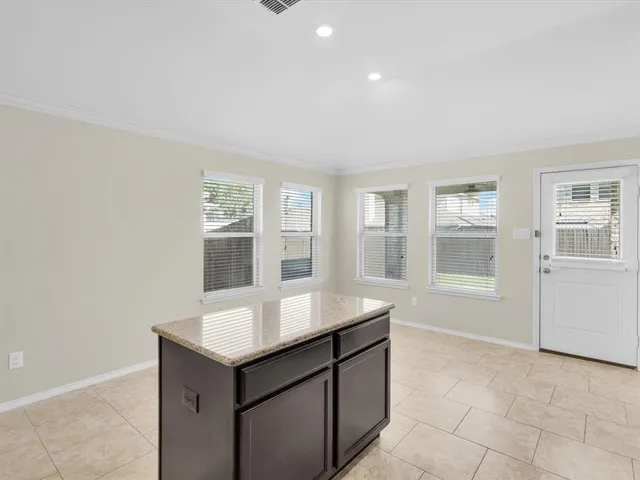 a room with a sink cabinets and utility room