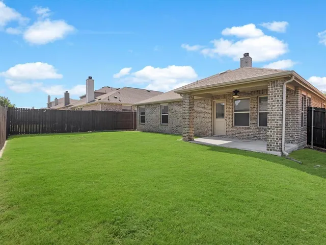 a view of a backyard with a garden