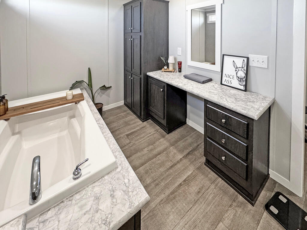 349 Private Road, Unit 243P Seminole, TX 79360 - Photo 12 of 24 a bathroom with a sink and a mirror