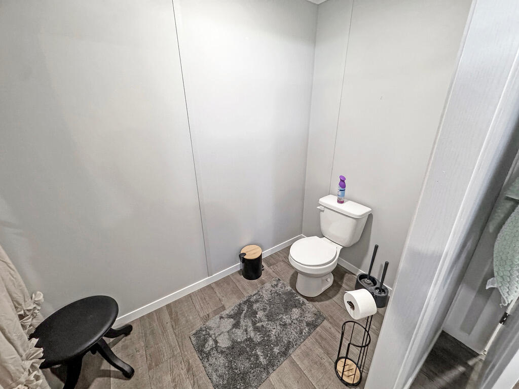 349 Private Road, Unit 243P Seminole, TX 79360 - Photo 13 of 24 a bathroom with a toilet