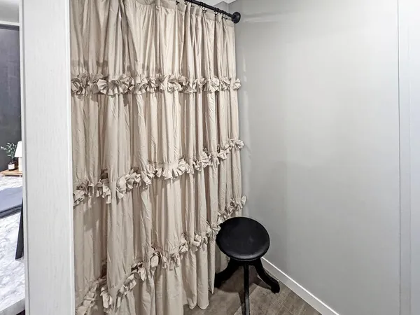 a bathroom with a toilet and a mirror