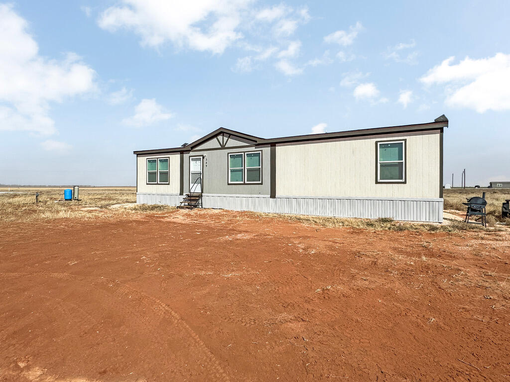 349 Private Road, Unit 243P Seminole, TX 79360 - Photo 2 of 24 a view of house with yard and ocean view
