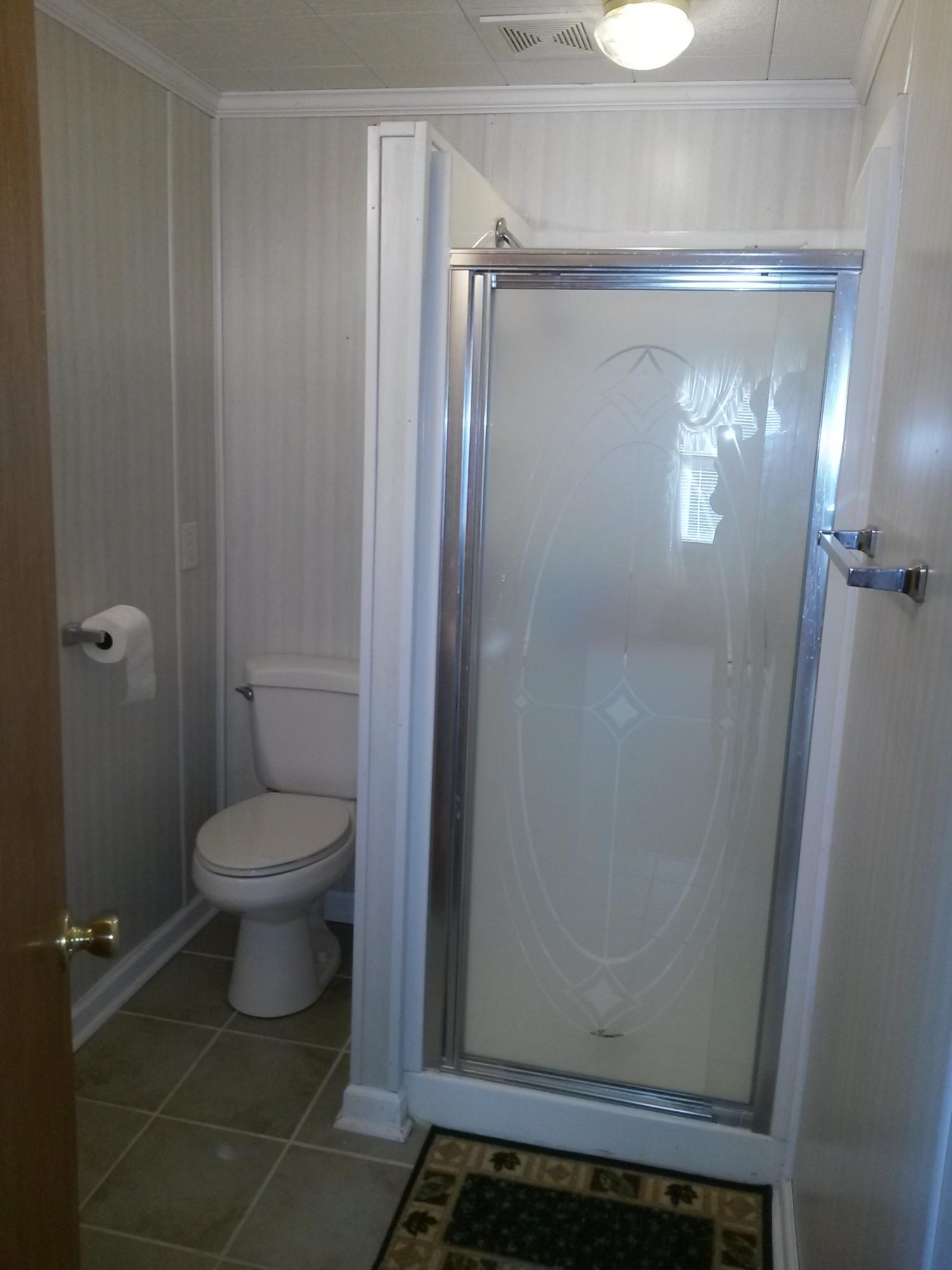 1020 Muse Field Road Rocky Mount, VA 24151 - Photo 2 of 43 a bathroom with a toilet and a shower