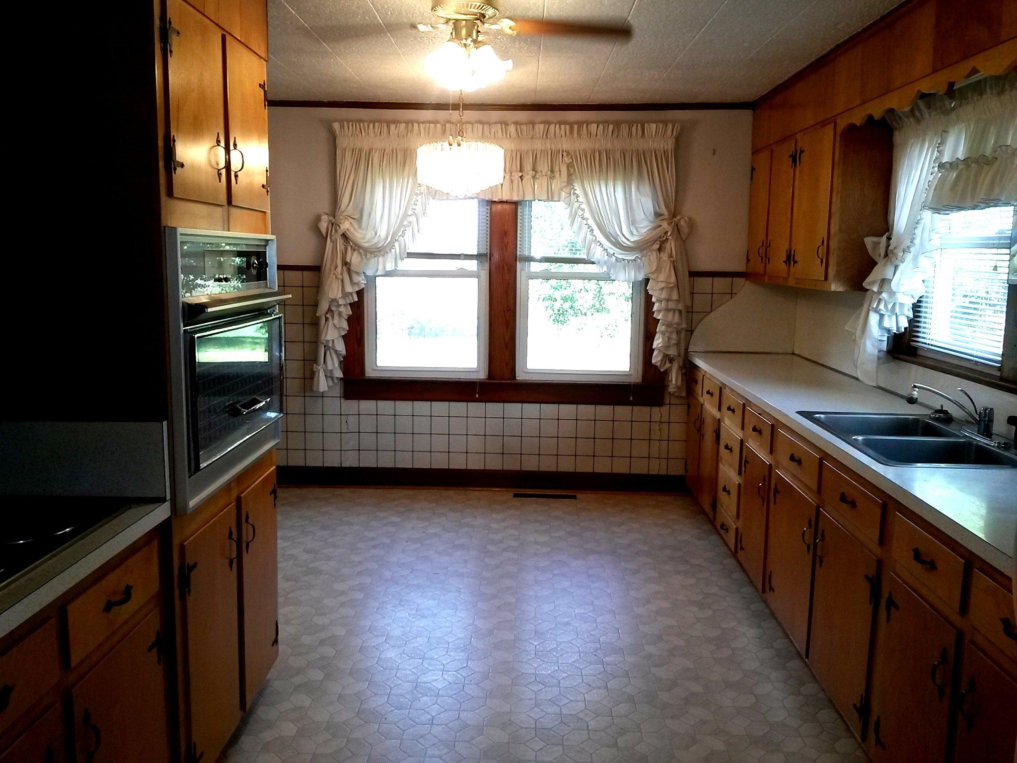 1020 Muse Field Road Rocky Mount, VA 24151 - Photo 26 of 43 a kitchen with granite countertop a sink a counter space appliances and cabinets
