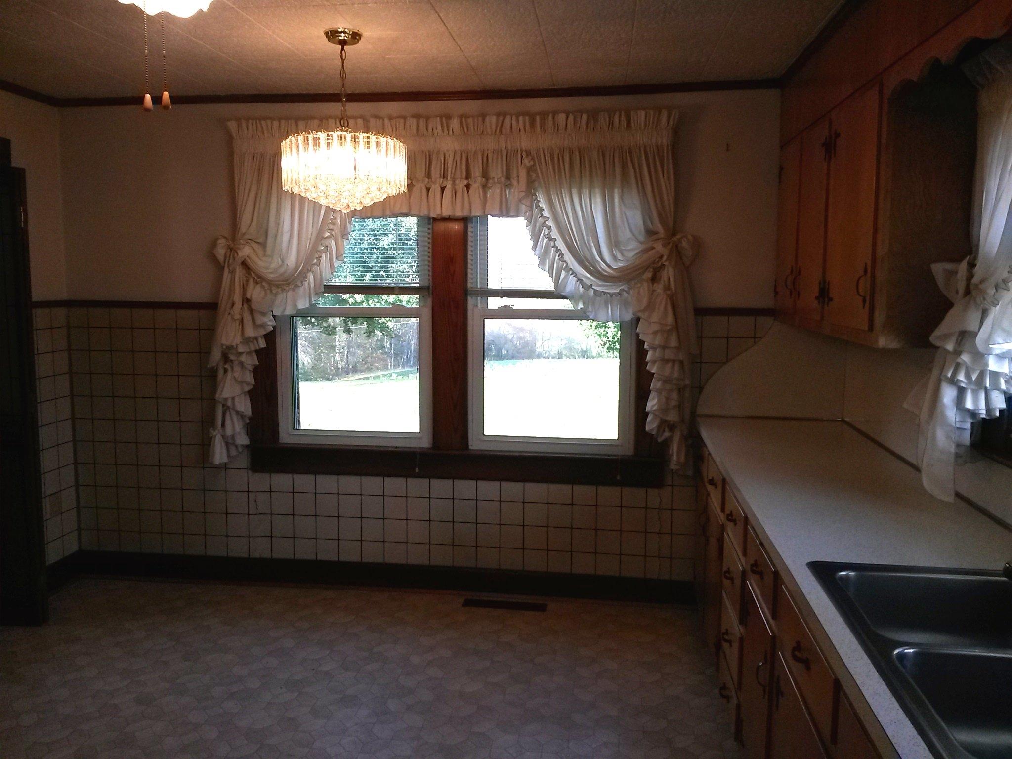 1020 Muse Field Road Rocky Mount, VA 24151 - Photo 27 of 43 a kitchen with windows and chandelier
