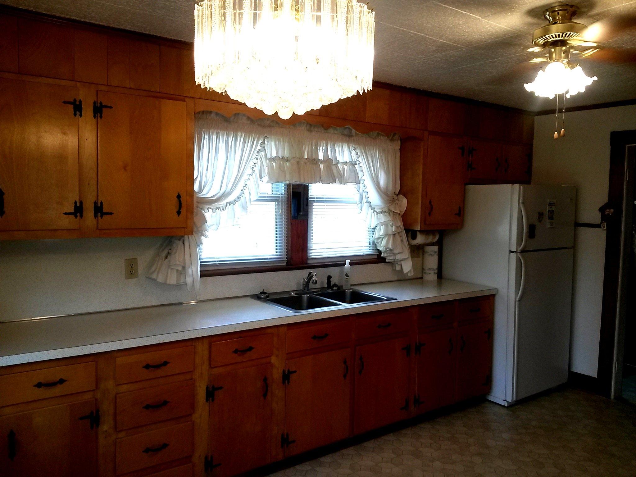 1020 Muse Field Road Rocky Mount, VA 24151 - Photo 29 of 43 a kitchen with stainless steel appliances a sink cabinets and a refrigerator