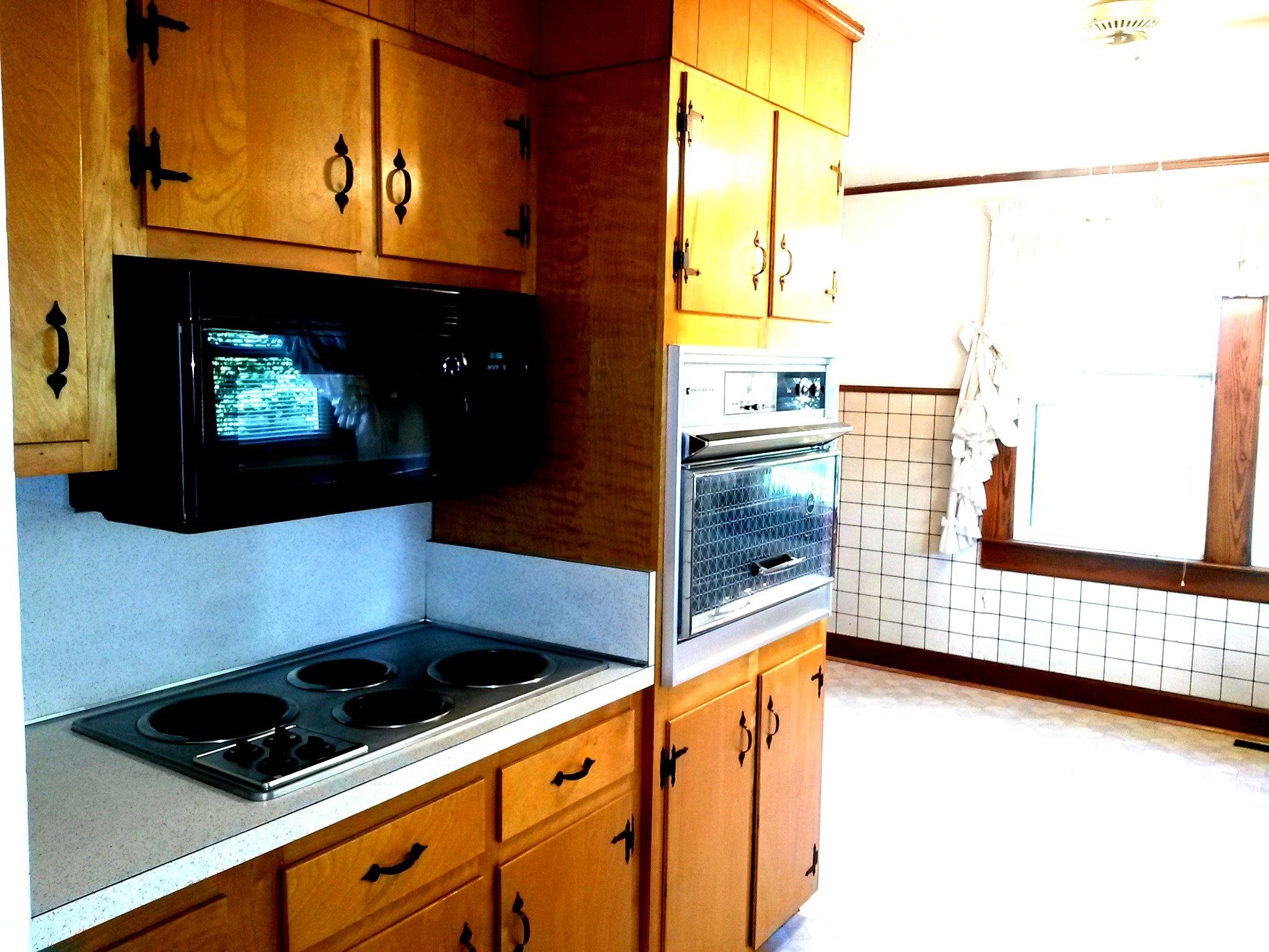 1020 Muse Field Road Rocky Mount, VA 24151 - Photo 41 of 43 a kitchen with stainless steel appliances a stove a refrigerator and a microwave