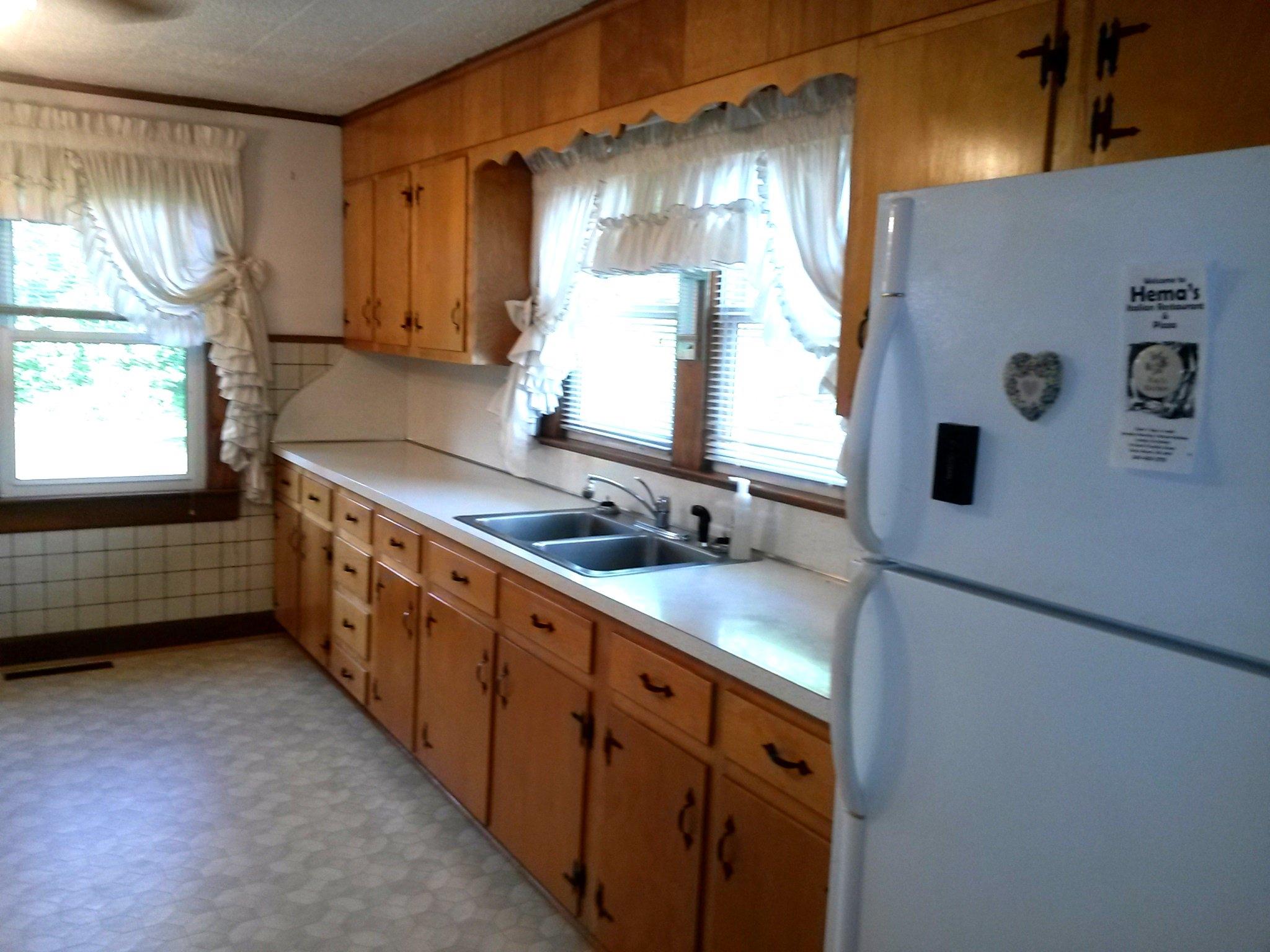 1020 Muse Field Road Rocky Mount, VA 24151 - Photo 42 of 43 a kitchen with stainless steel appliances a sink stove and window