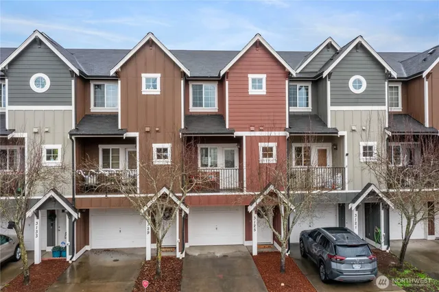 a front view of a house with garage