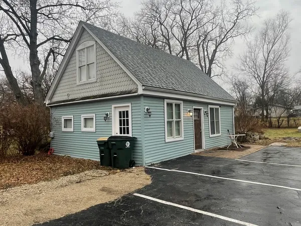 a front view of a house with yard