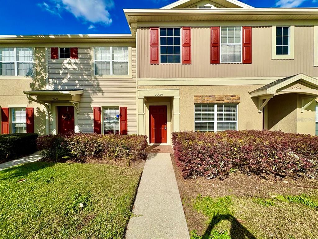 15619 Stable Run Drive Spring Hill, FL 34610 - Photo 1 of 28 a front view of a house with a garden