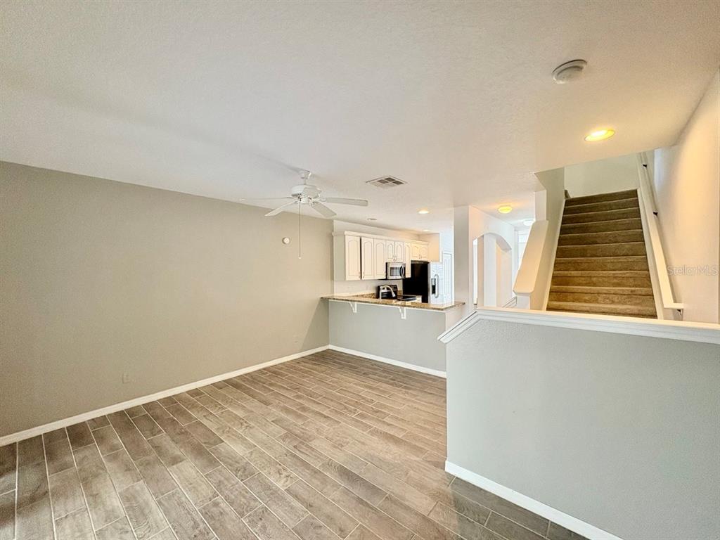 15619 Stable Run Drive Spring Hill, FL 34610 - Photo 15 of 28 a view of a kitchen with wooden floor and a sink