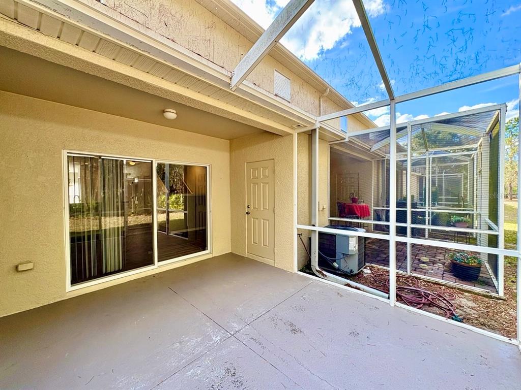15619 Stable Run Drive Spring Hill, FL 34610 - Photo 26 of 28 a view of a room with wooden floor and windows