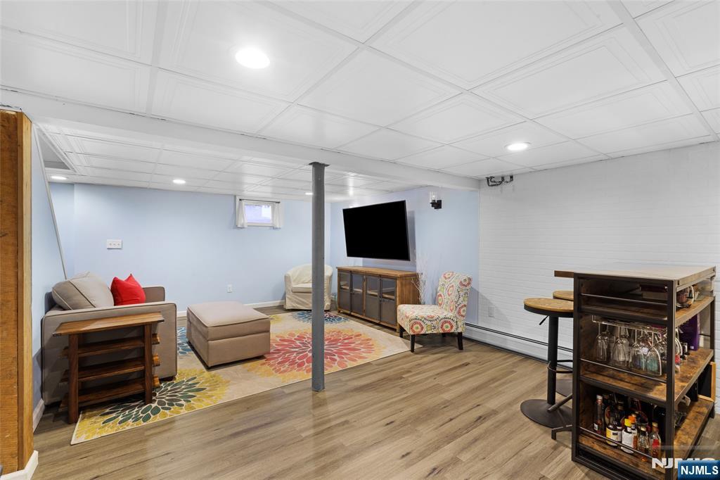 479 South Pleasant Avenue Ridgewood, NJ 07450 - Photo 20 of 26 a living room with furniture and a flat screen tv