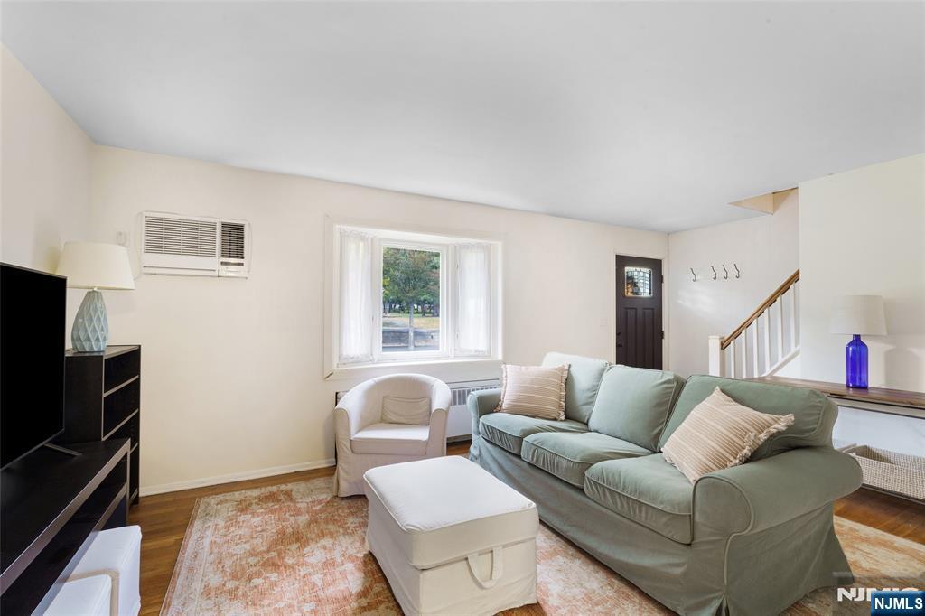 479 South Pleasant Avenue Ridgewood, NJ 07450 - Photo 2 of 26 a living room with furniture and a flat screen tv