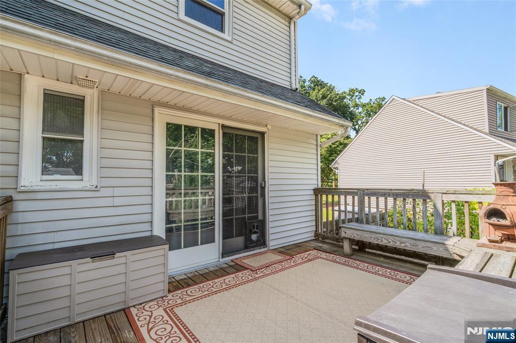 479 South Pleasant Avenue Ridgewood, NJ 07450 - Photo 23 of 26 a view of a wooden deck with a bench