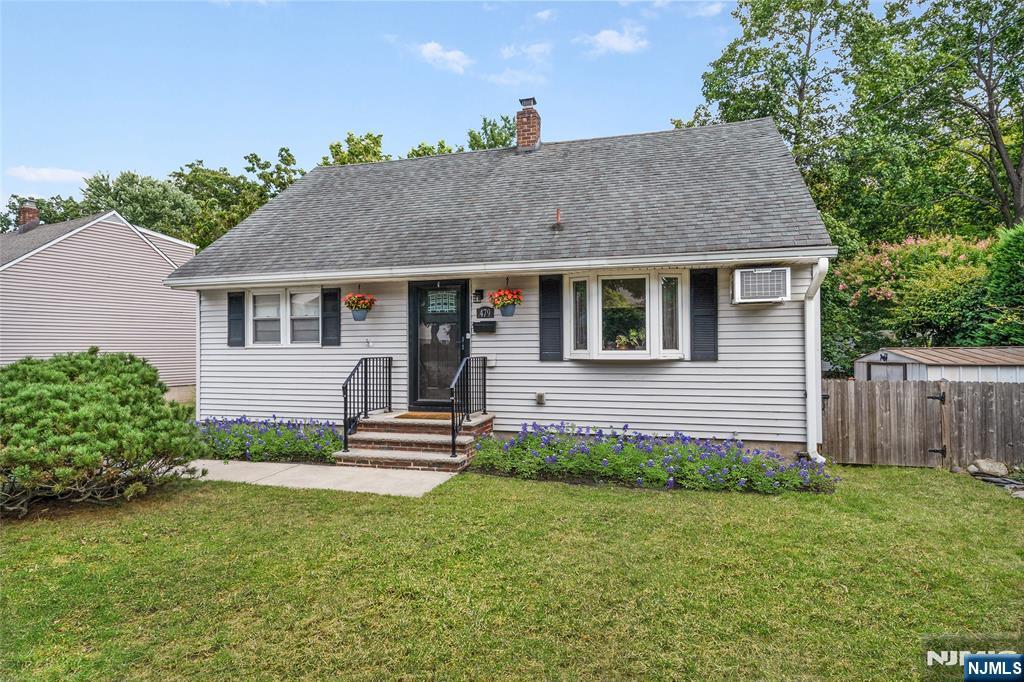 479 South Pleasant Avenue Ridgewood, NJ 07450 - Photo 25 of 26 a front view of a house with a garden