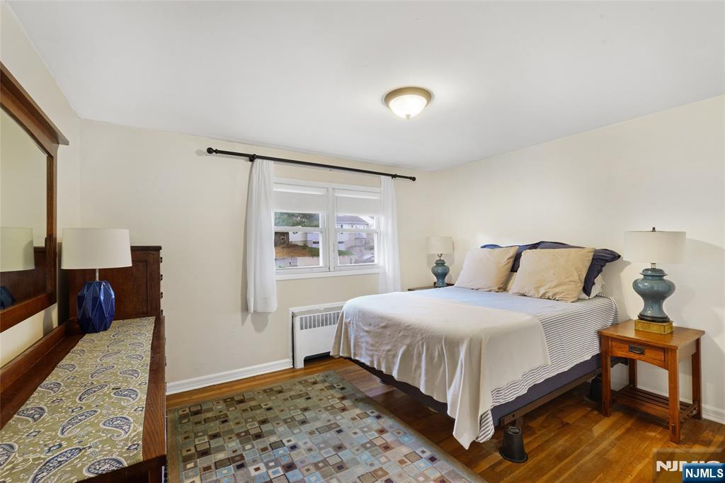 479 South Pleasant Avenue Ridgewood, NJ 07450 - Photo 10 of 26 a bedroom with a bed and a dresser with rug