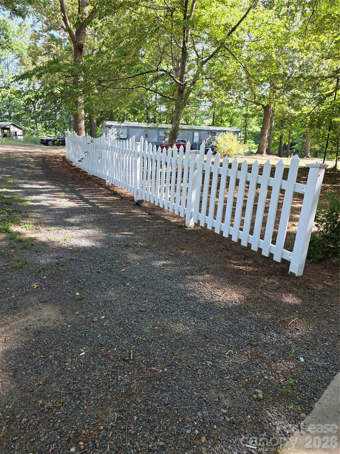 5710 Unionville Road Monroe, NC 28110 - Photo 17 of 18 a view of a yard with wooden fence