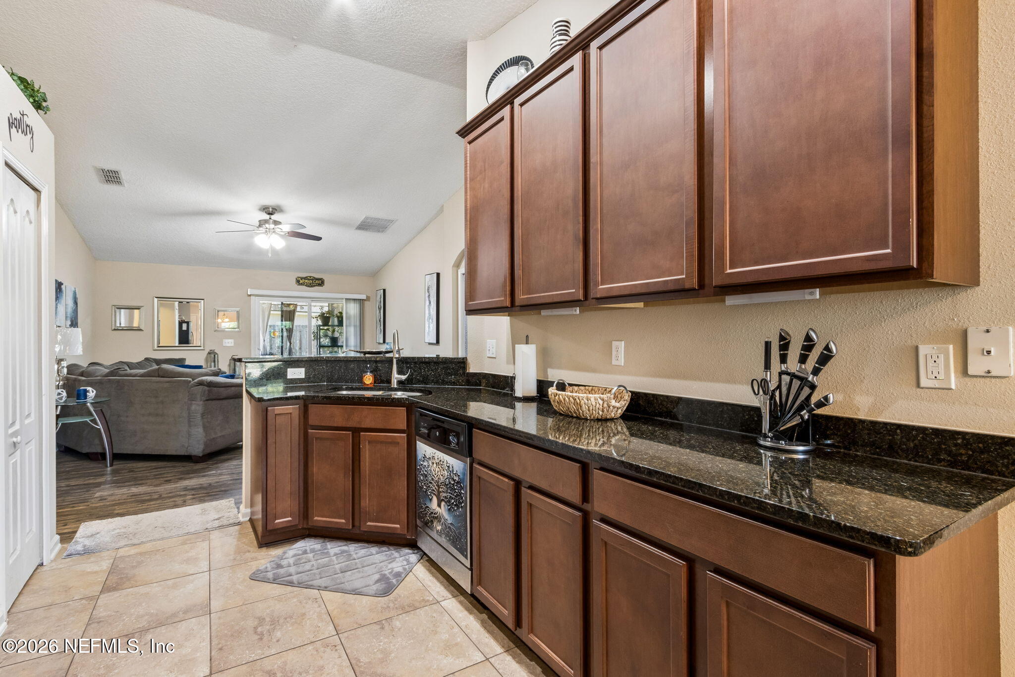 96034 Bass Lane Yulee, FL 32097 - Photo 20 of 50 a kitchen with a sink and a stove top oven