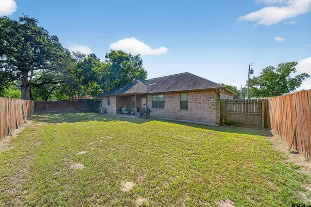 a swimming pool with wooden fence