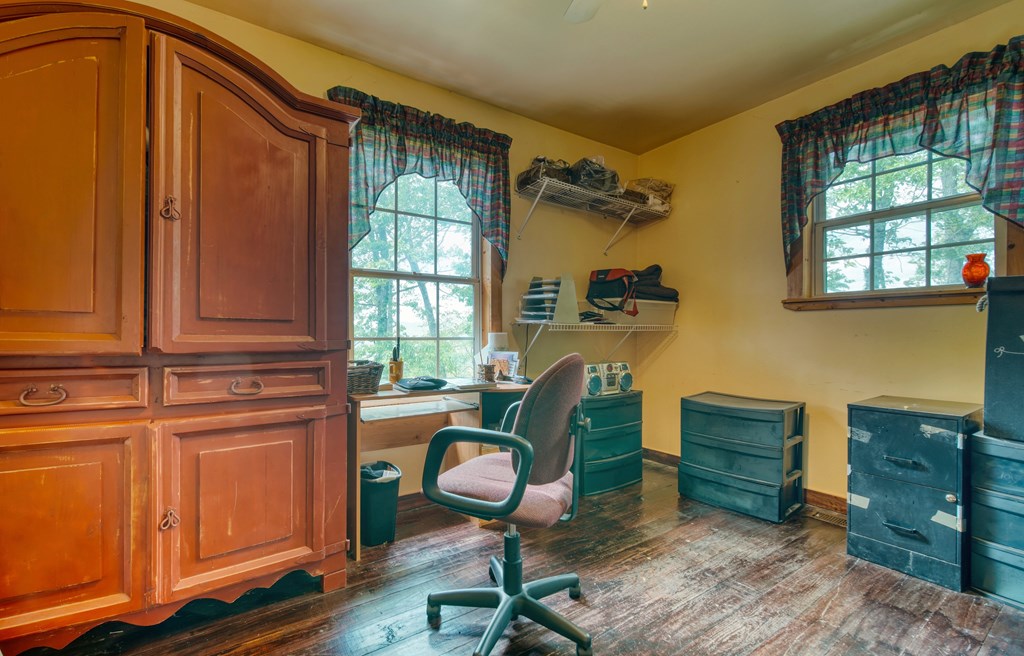911 Summit Way Blairsville, GA 30512 - Photo 12 of 23 a view of a workspace with furniture and a window
